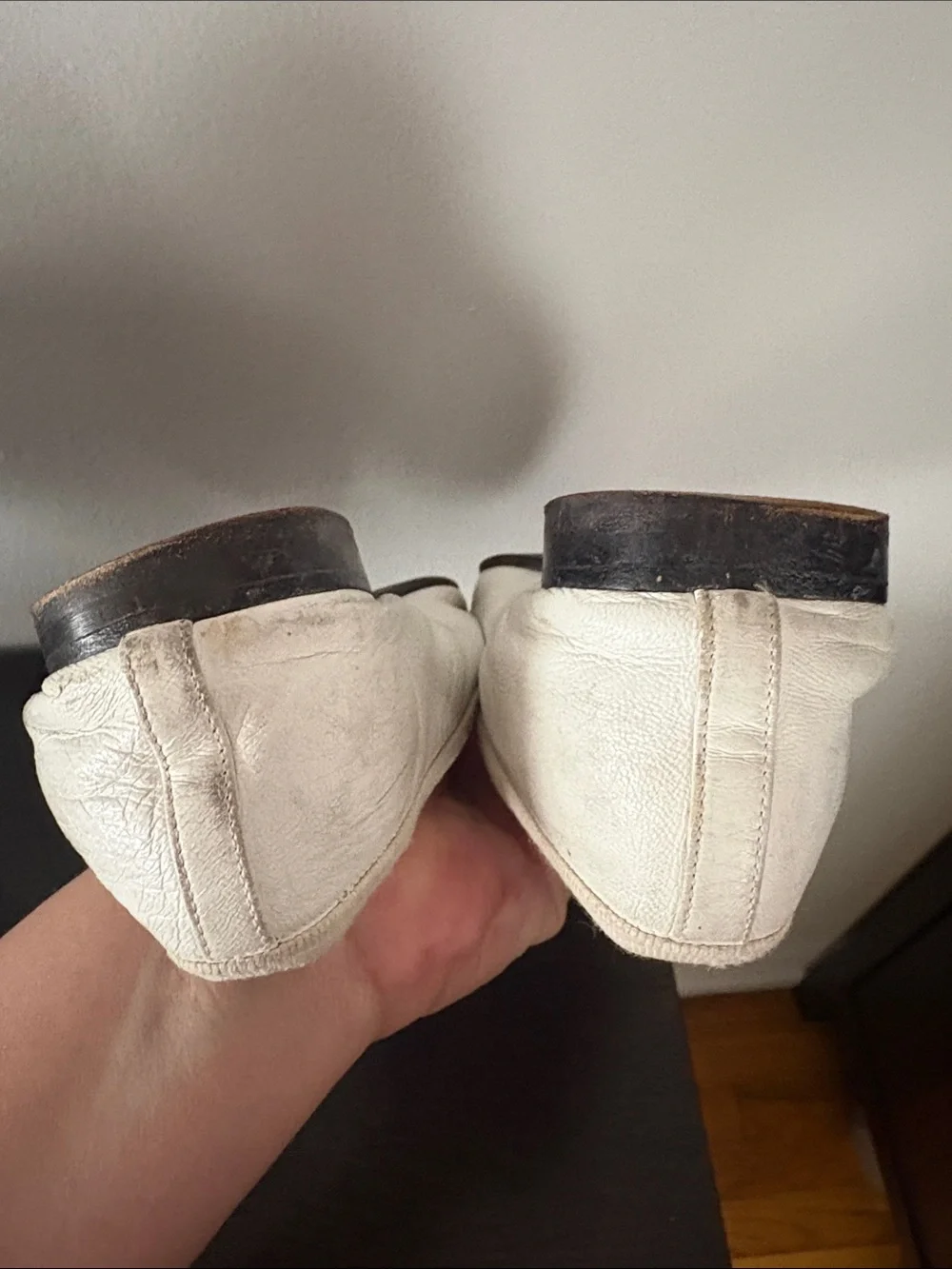 CHANEL White Leather Ballet Flats with Black Cap Toe and Bow